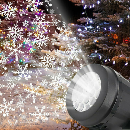 Large Christmas projector lighting up a garden tree at night