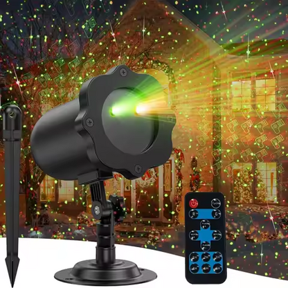 Red and green star laser light shower on a house front at night
